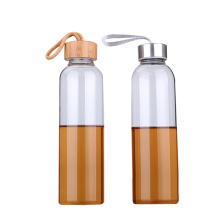 Bouteille d&#39;eau de boisson en verre borosilicaté avec couvercle en bambou ou en acier inoxydable personnalisé en gros avec poignée
